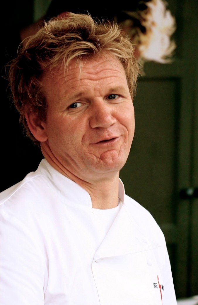 A professional chef, representing the celebrity-chef and food-television era that popularized gourmet chicken cooking