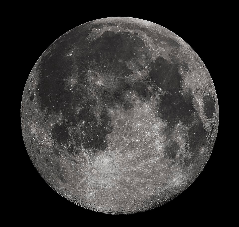 The full Moon glowing against a black sky, known in June as the Strawberry Moon