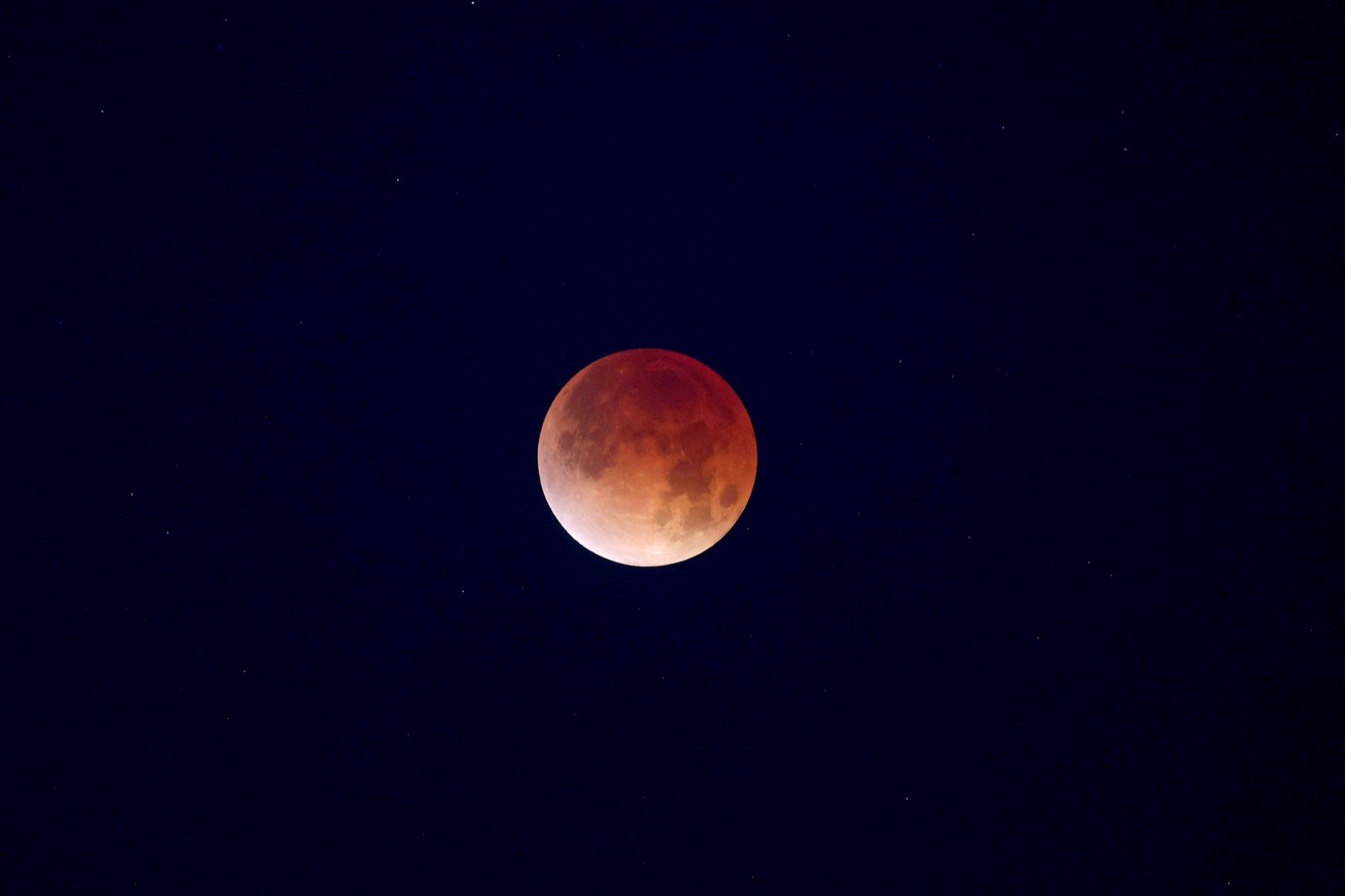 The Moon glowing deep red during the total lunar eclipse of March 3, 2026, photographed over NASA's Michoud Assembly Facility in New Orleans