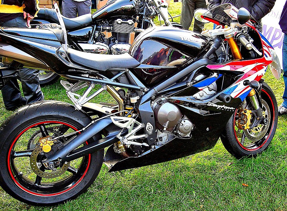 Modern black Triumph Daytona supersport motorcycle with Union Flag racing livery on display