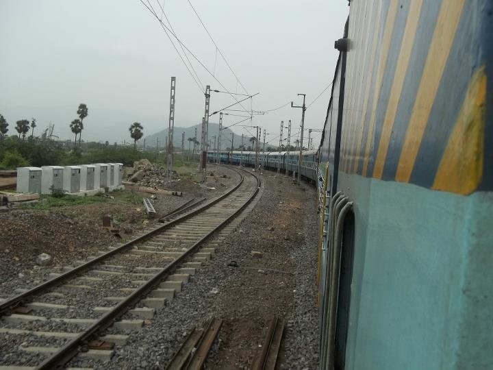A conventional LHB-rake passenger train on Indian Railways tracks