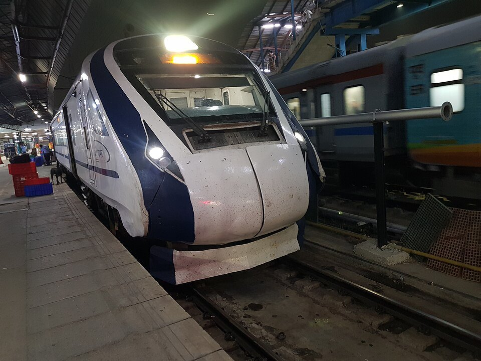 A Vande Bharat trainset at a railway station platform