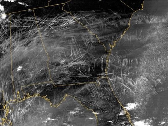 Satellite image showing widespread aircraft contrails over the southeastern United States