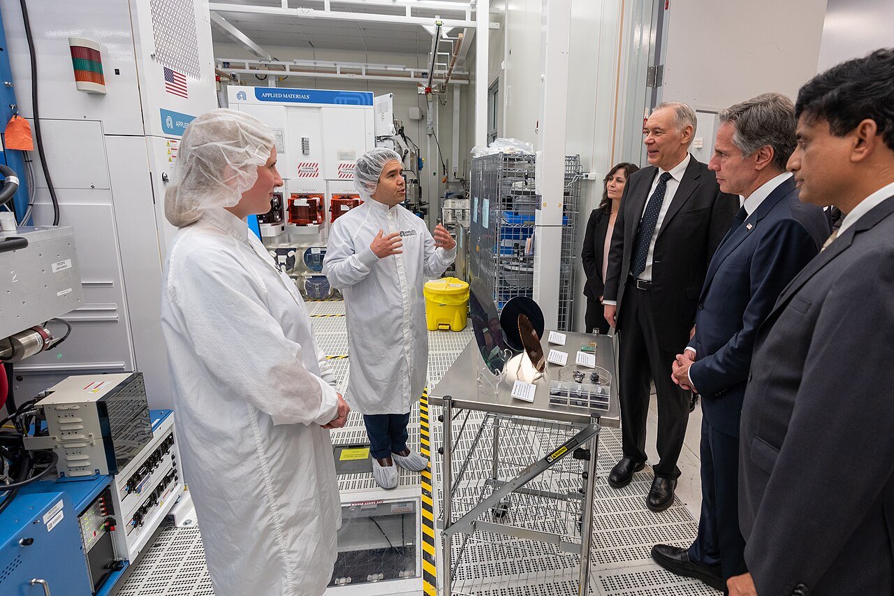 Engineers in cleanroom suits show US Secretary of State Antony Blinken around the Maydan Technology Center in October 2022