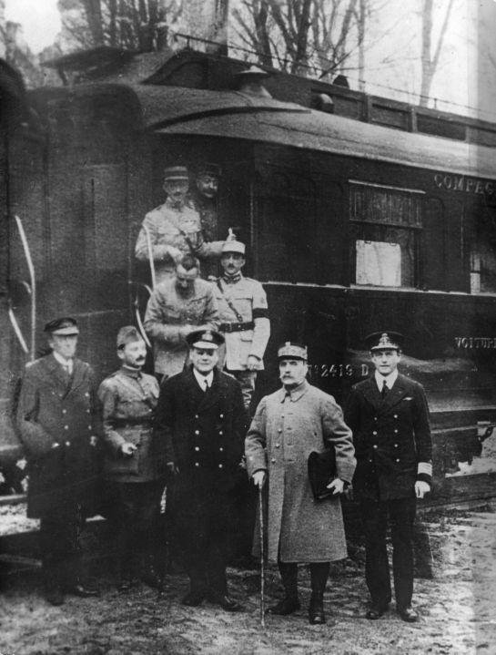 Marshal Foch and Allied delegates outside railway carriage 2419 D at Compiegne after the Armistice was signed, 11 November 1918