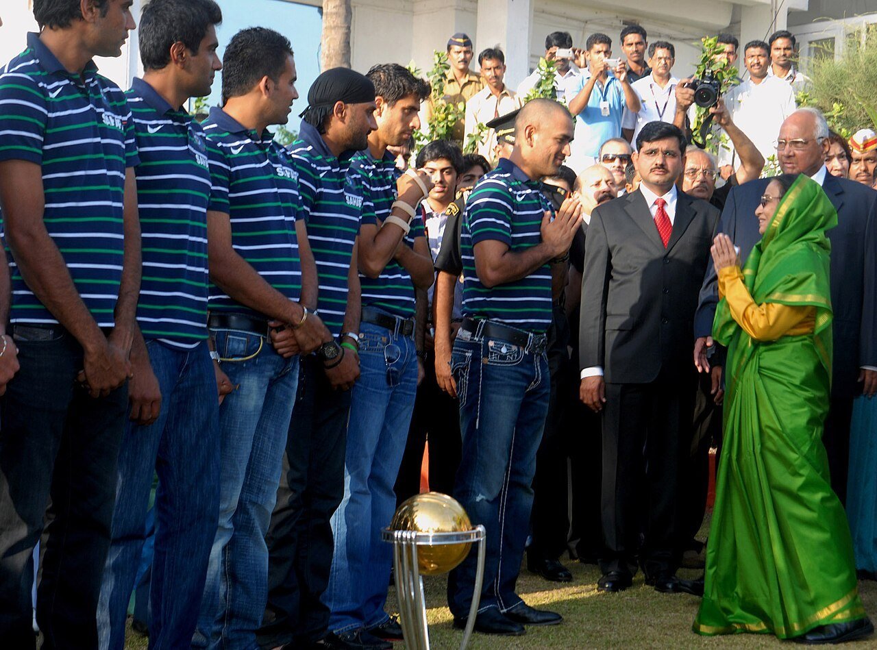 President Pratibha Patil greets the Indian team, with the trophy, at Raj Bhavan in Mumbai on 3 April 2011, the day after the final
