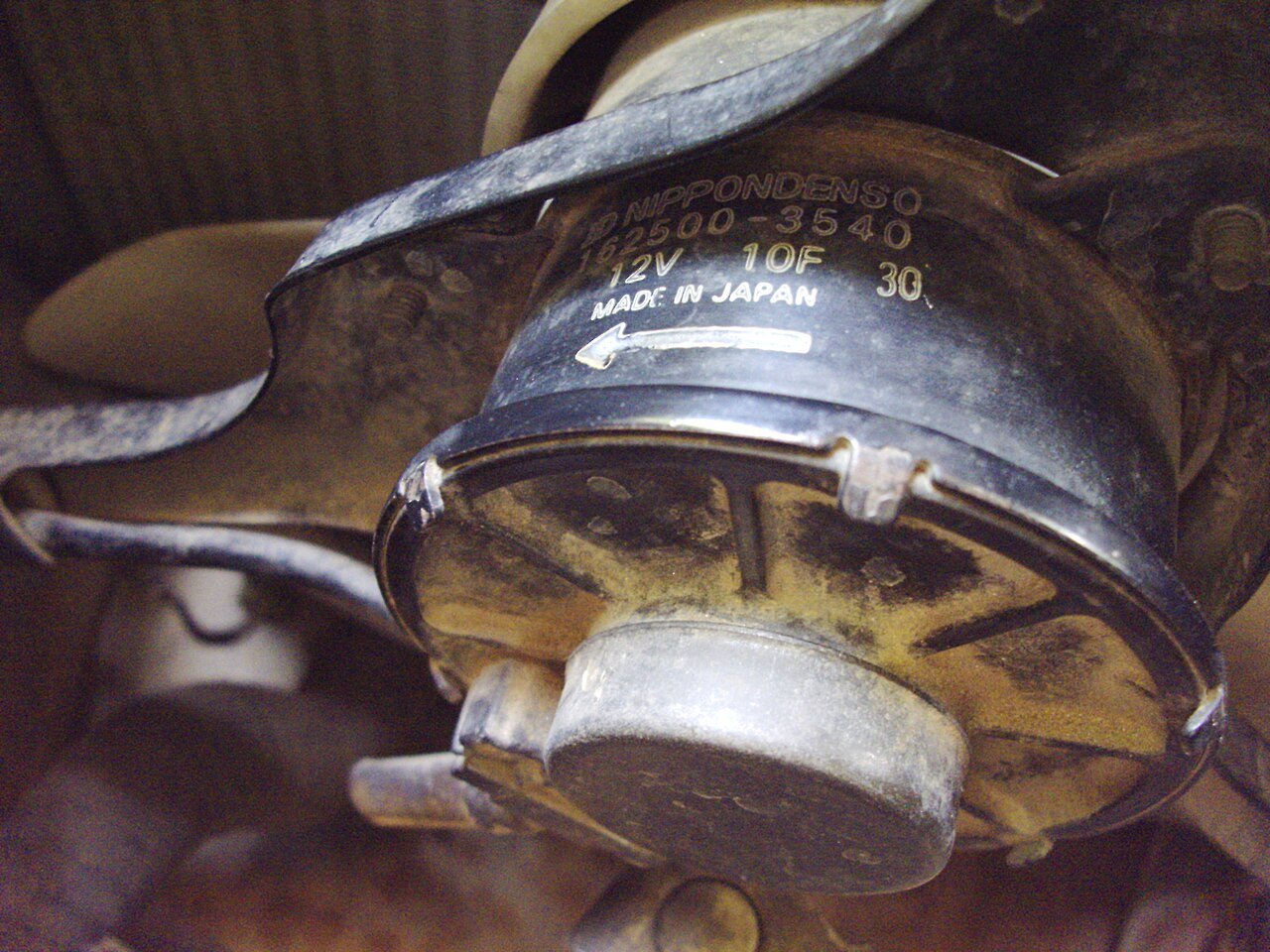 Nippondenso radiator fan motor marked Made in Japan inside an early Maruti 800
