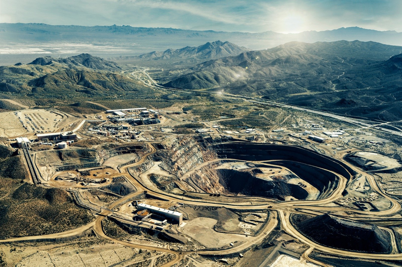 Aerial view of the Mountain Pass rare-earth mine and processing facility in California, showing the open-pit mine and on-site chemical processing plant