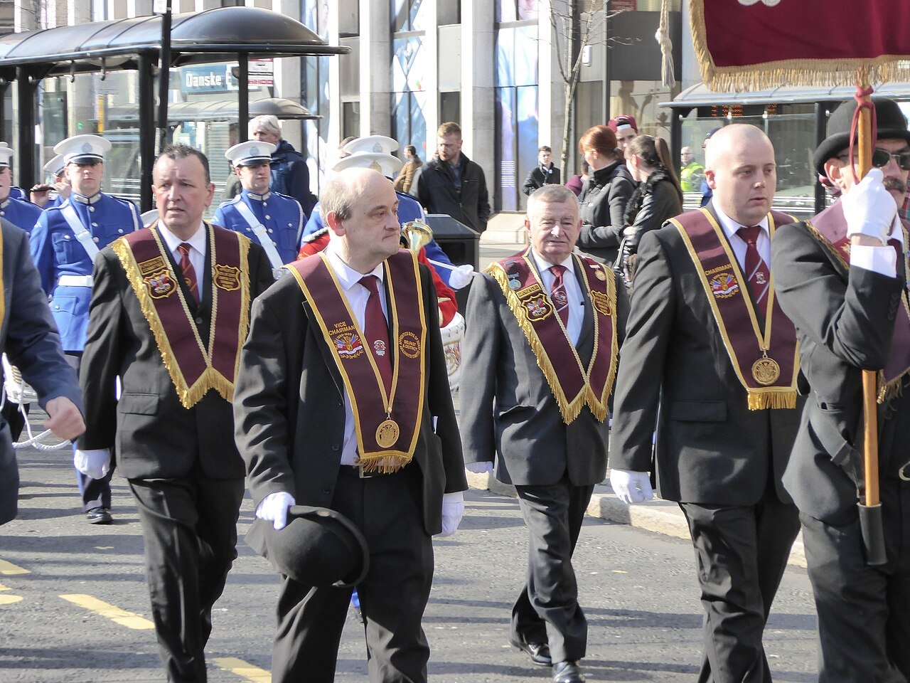 Apprentice Boys of Derry members in sashes and bowler hats parading through Belfast city centre in April 2015