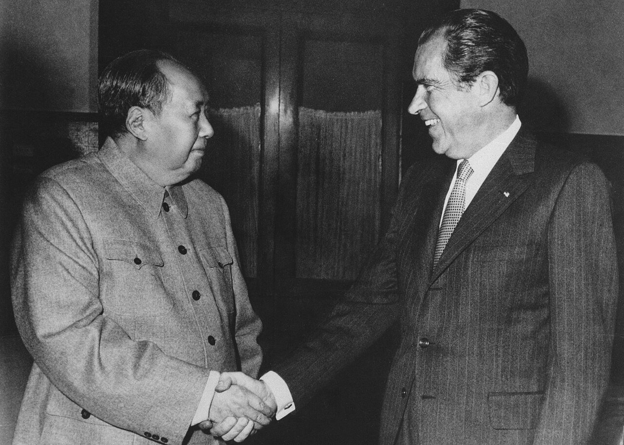 Richard Nixon shakes hands with Mao Zedong in Beijing on 21 February 1972