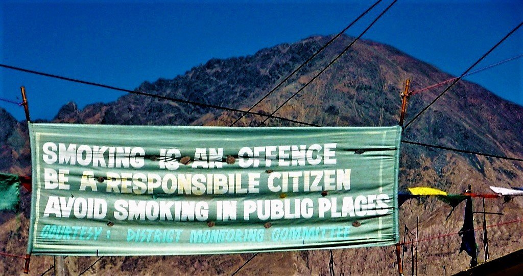A district monitoring committee banner in Leh