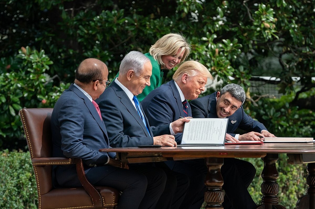 Bahrain’s foreign minister Abdullatif Al Zayani, Israeli Prime Minister Benjamin Netanyahu, President Donald Trump and UAE foreign minister Abdullah bin Zayed sign the Abraham Accords at the White House, 15 September 2020