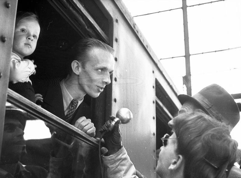 A man and a child at the window of a train in Berlin on the day the blockade ended