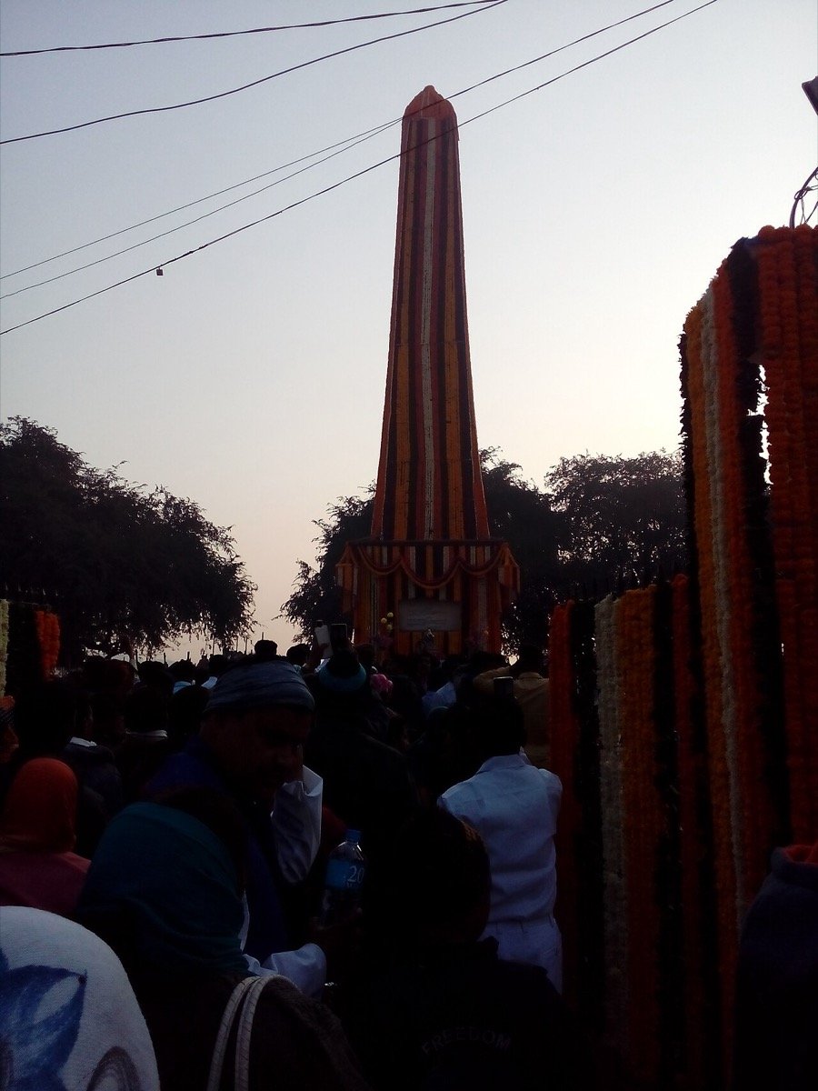 Crowds and garlands at the Vijay Stambh, Bhima Koregaon, during the 1 January commemoration
