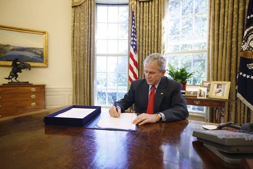 President Bush signs the Emergency Economic Stabilization Act