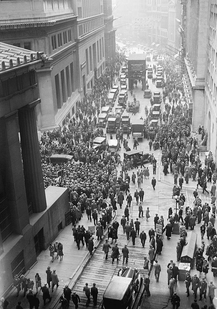 A crowd gathers on Wall Street outside the Stock Exchange on Black Tuesday, 29 October 1929