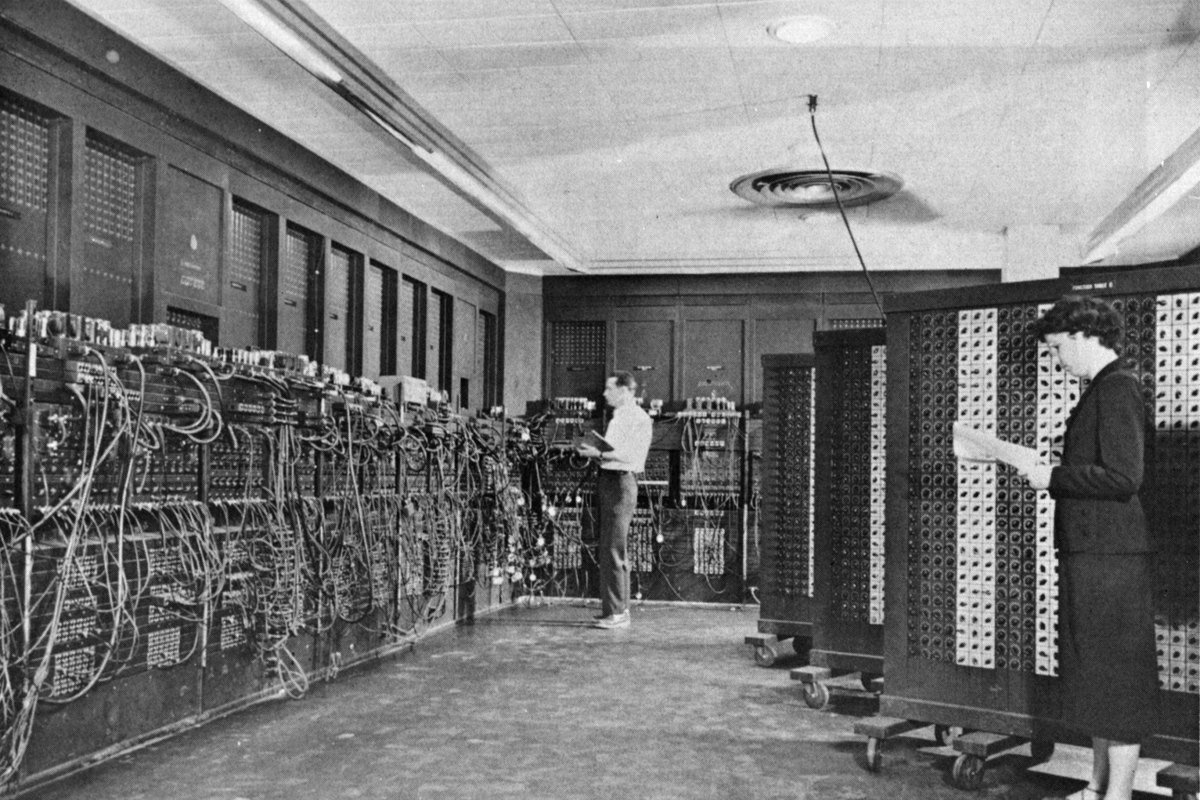 Glen Beck (background) and Betty Snyder (foreground) program ENIAC in building 328 at the Ballistic Research Laboratory, about 1947
