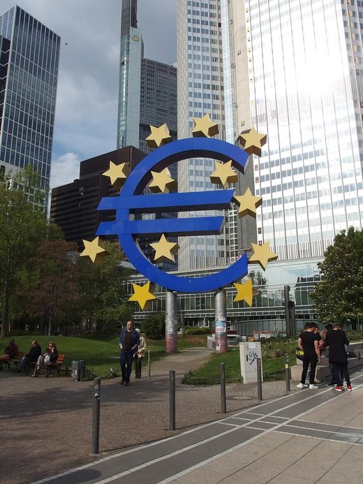 The euro sign sculpture outside the Eurotower in Frankfurt