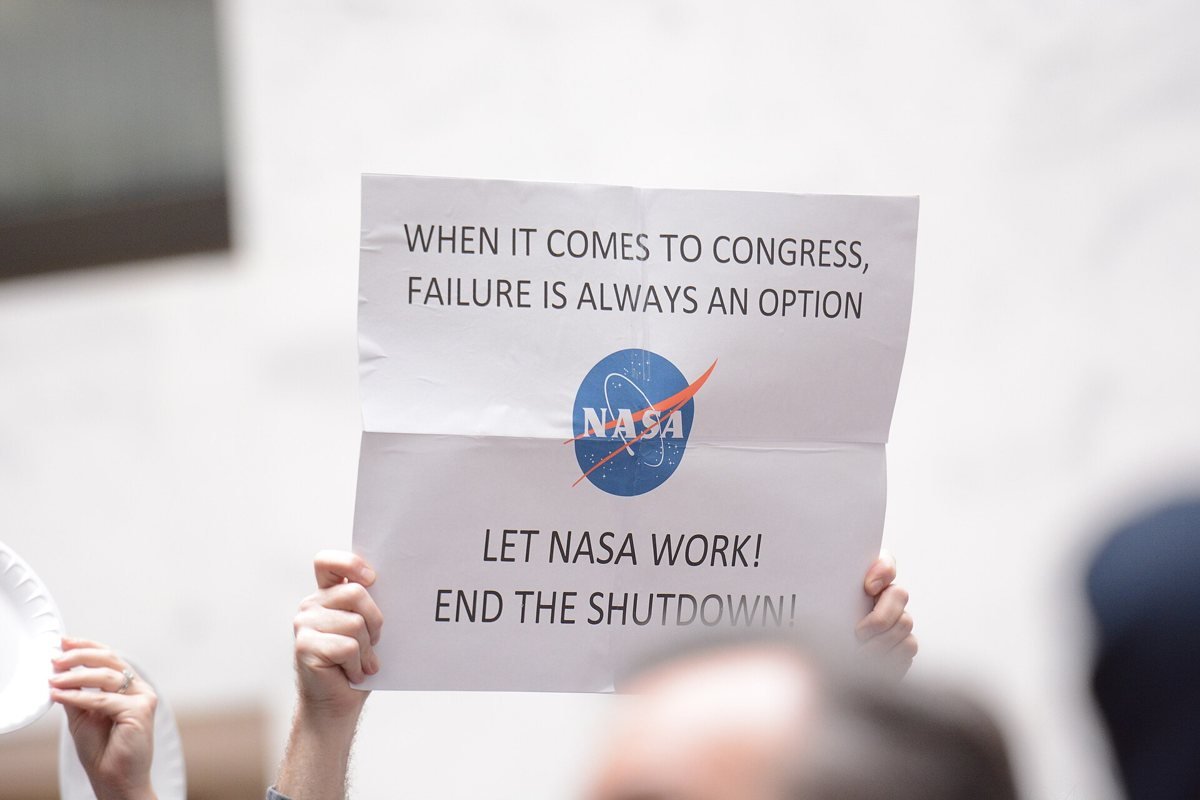 Federal workers and union members hold a silent protest at the Hart Senate Office Building on 23 January 2019, one minute for each day of the shutdown