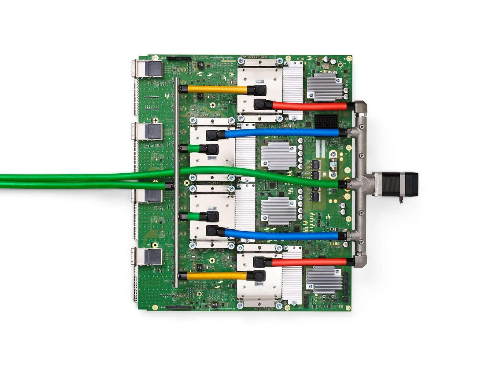 A Google TPU v4 board with four liquid-cooled AI accelerator chips