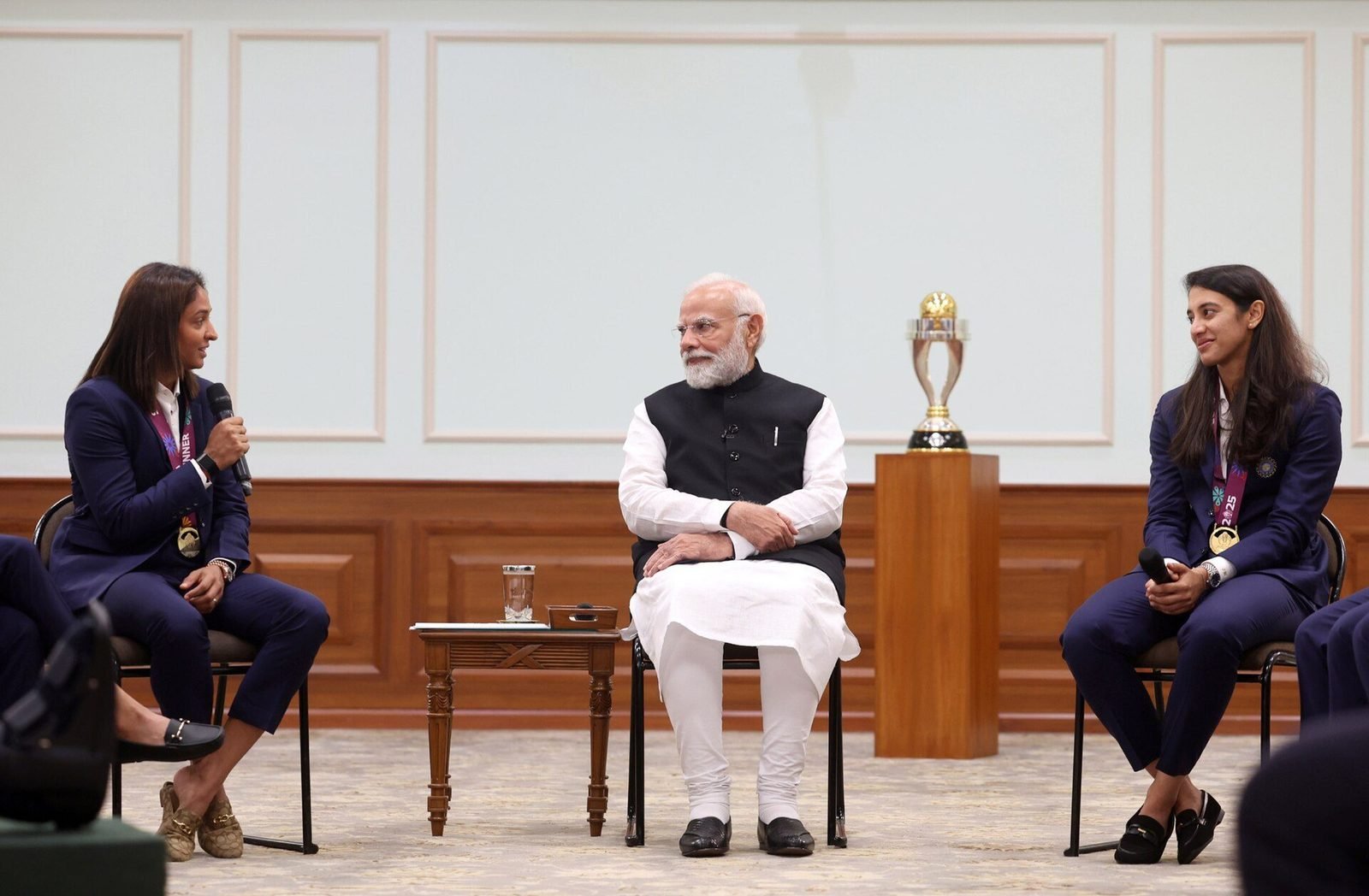 Harmanpreet Kaur speaks as Narendra Modi and Smriti Mandhana listen, three days after the World Cup final, 5 November 2025