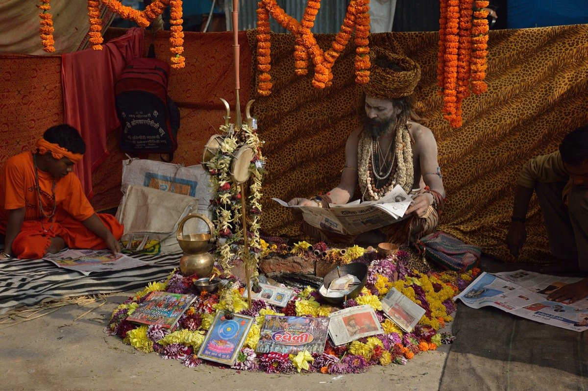 A reader with a Hindi newspaper at a transit camp in Kolkata, January 2016