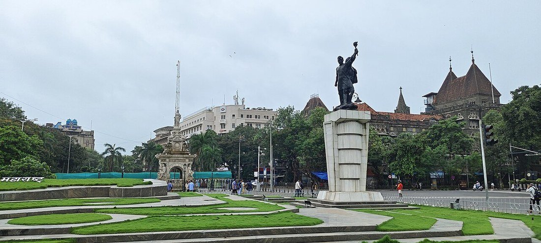 The Hutatma Chowk memorial statue and Flora Fountain at a green traffic island in Mumbai