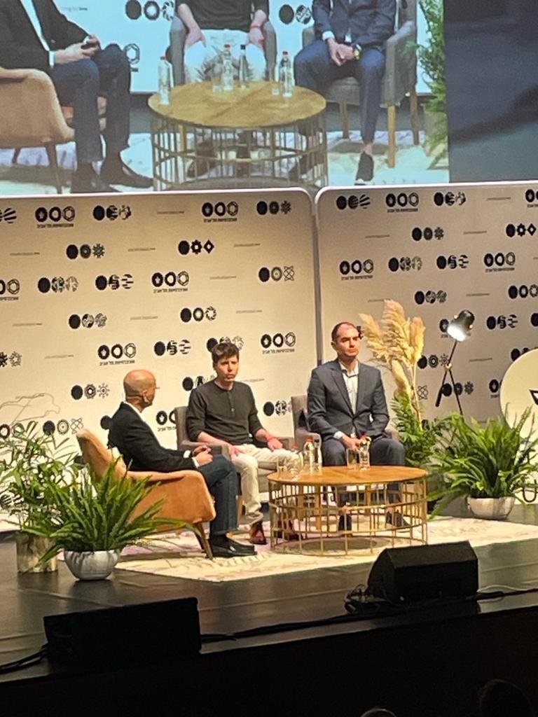 Ilya Sutskever and Sam Altman seated on stage at Tel Aviv University in June 2023