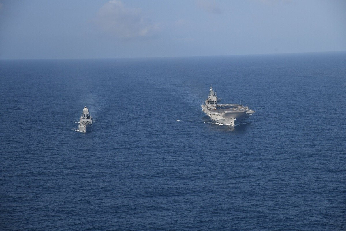 INS Vikrant, India’s first indigenously built aircraft carrier, with the destroyer INS Kolkata during sea trials in July 2022