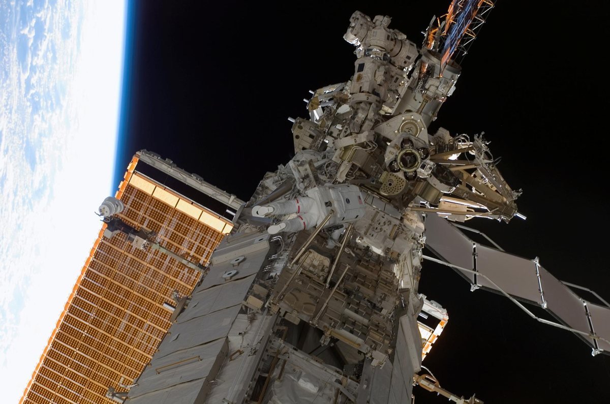 A space-station heat-rejection radiator and solar array during a 2007 spacewalk