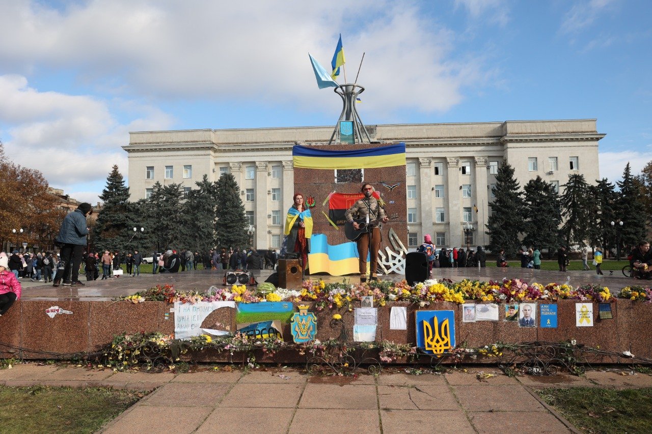 Residents gather in front of the regional administration in Kherson on 19 November 2022, eight days after Ukrainian troops entered the city