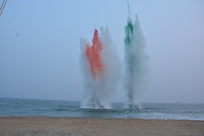 Tricolour water plumes during the Navy Day 2022 operational demonstration in Visakhapatnam, the first held outside Delhi