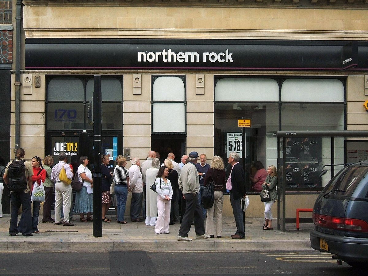 Customers queue outside the Northern Rock branch on North Street, Brighton