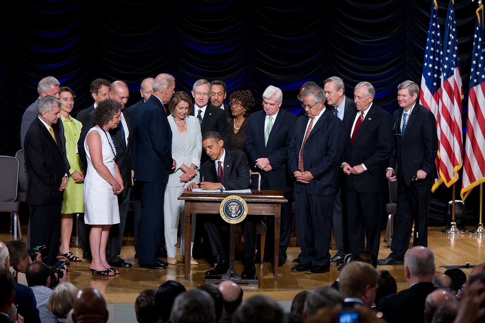 President Barack Obama signs the Dodd-Frank Wall Street Reform and Consumer Protection Act at the Ronald Reagan Building, Washington, 21 July 2010