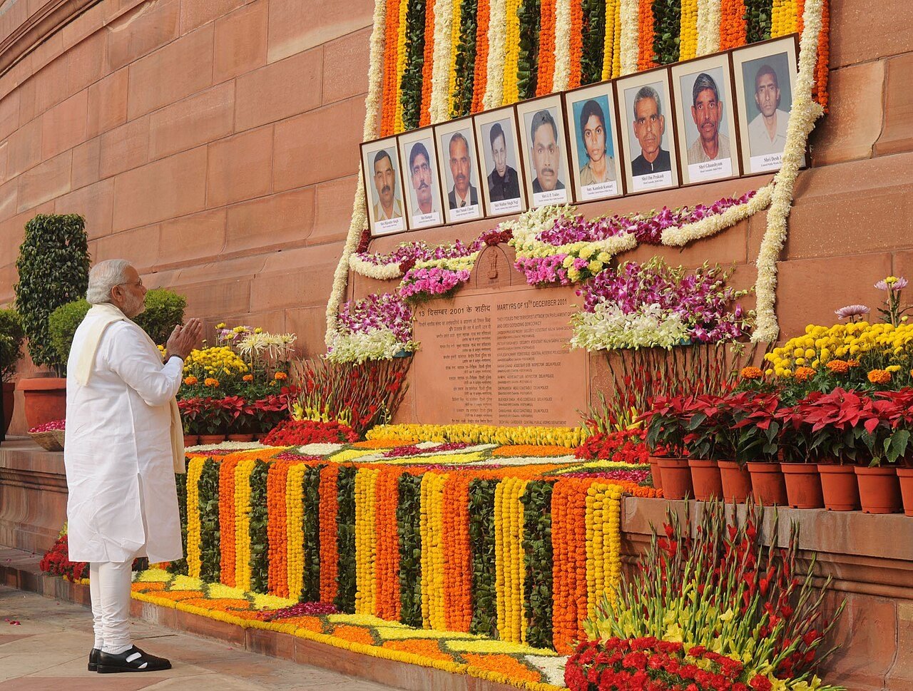 The memorial plaque with portraits of those killed, during the annual tribute in December 2014