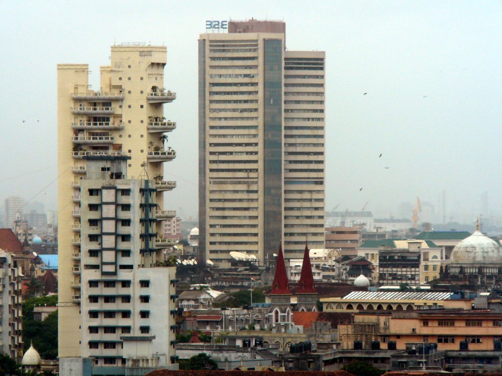 The tall Phiroze Jeejeebhoy Towers rising above the Fort district skyline of Mumbai