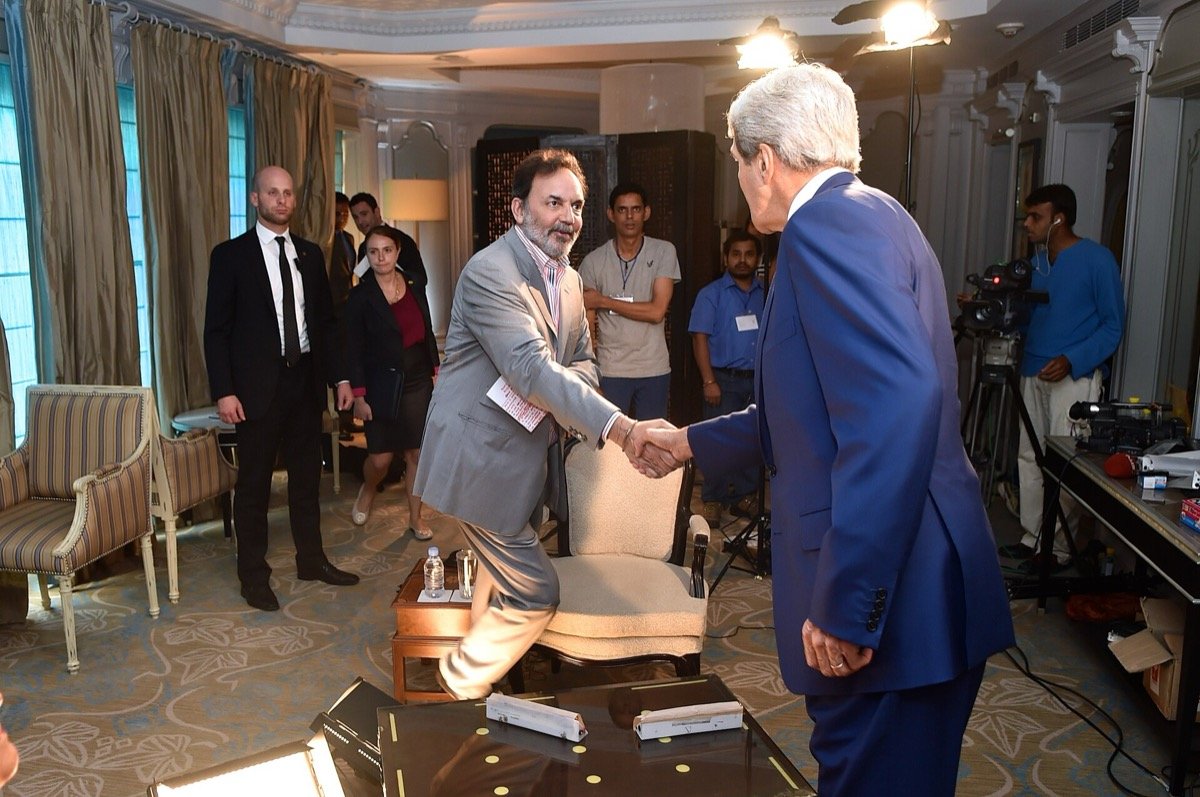 Prannoy Roy greets US Secretary of State John Kerry before an NDTV interview in New Delhi, 31 July 2014