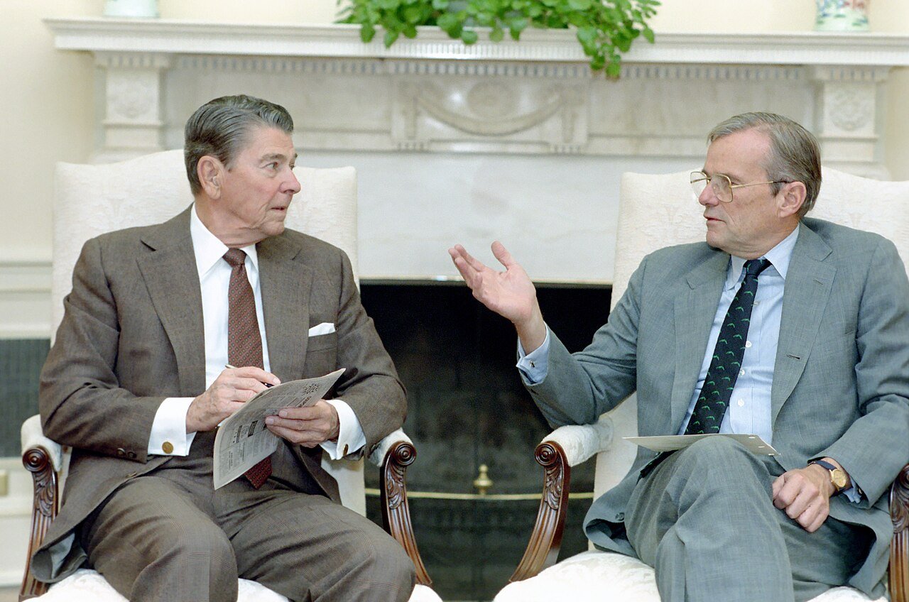 Nicholas Brady, who chaired the presidential task force on the crash, meets President Reagan in the Oval Office on 21 September 1988, days after becoming Treasury Secretary