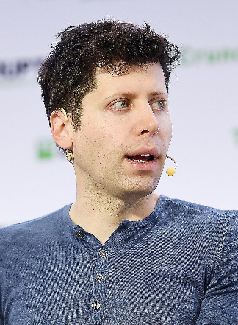 Sam Altman speaking on stage at TechCrunch Disrupt San Francisco in 2019