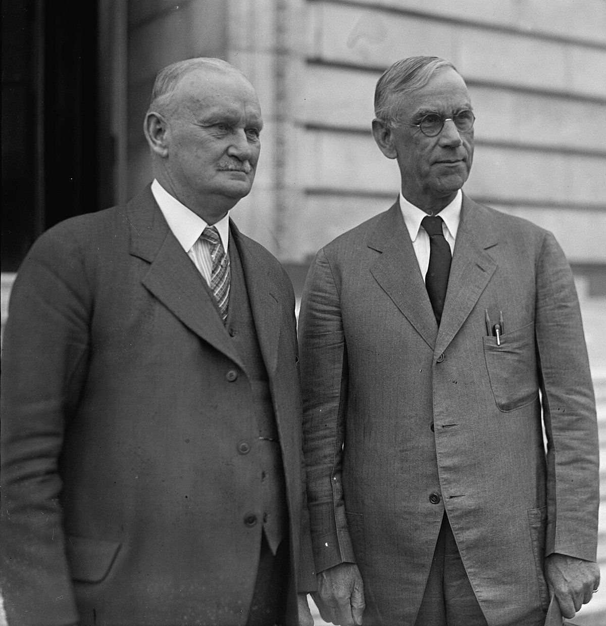 Representative Willis Hawley (left) and Senator Reed Smoot in April 1929