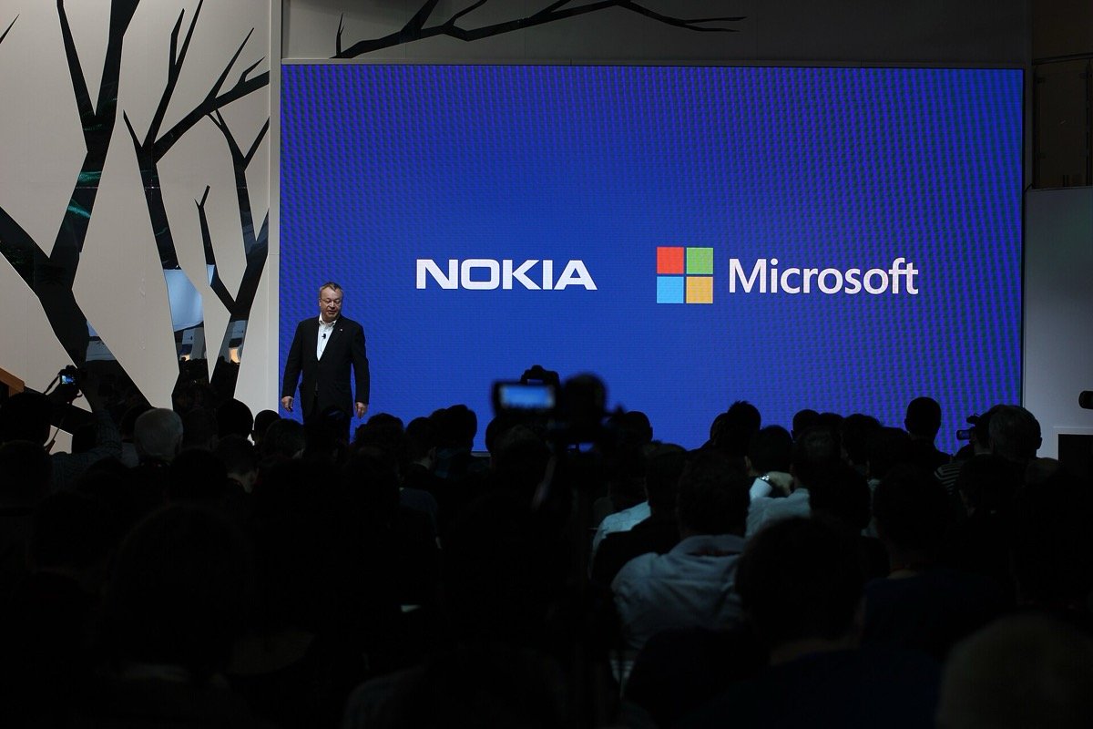 Stephen Elop on stage under Nokia and Microsoft logos at Mobile World Congress, Barcelona, 24 February 2014