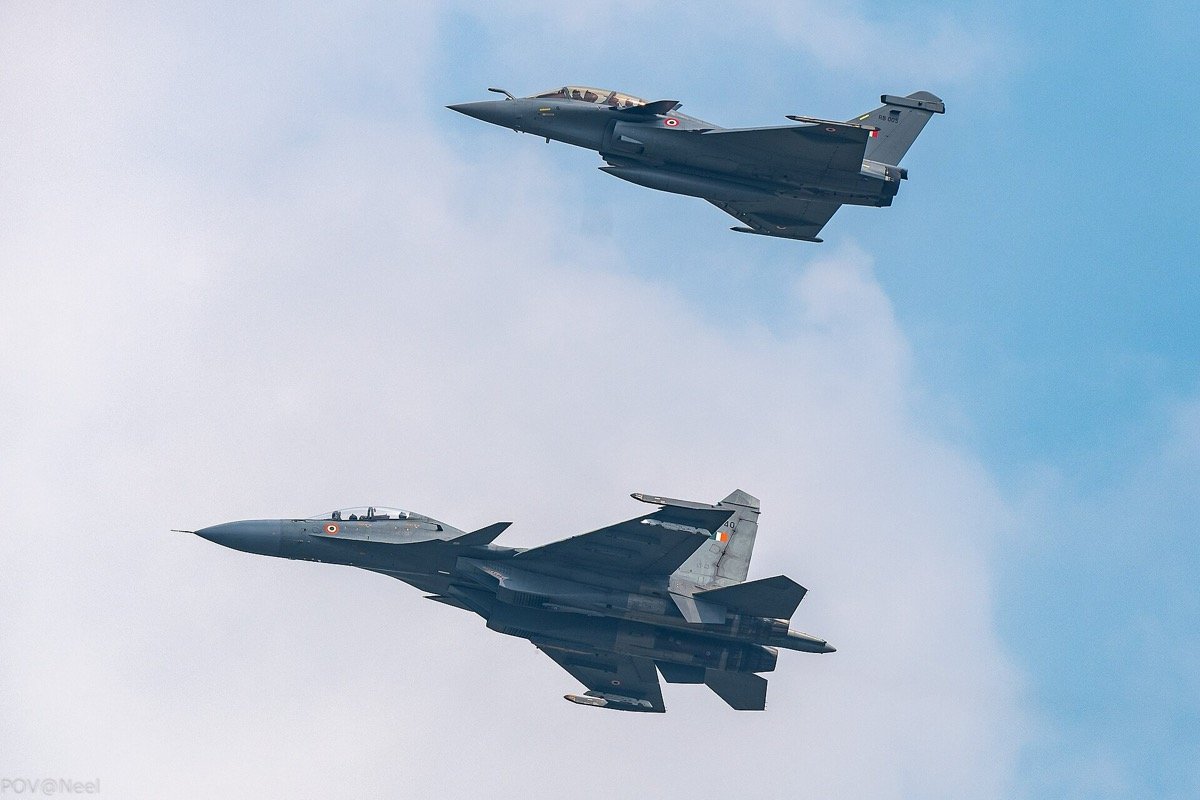 A Russian-designed Su-30MKI and a French Rafale of the Indian Air Force fly in formation, October 2021