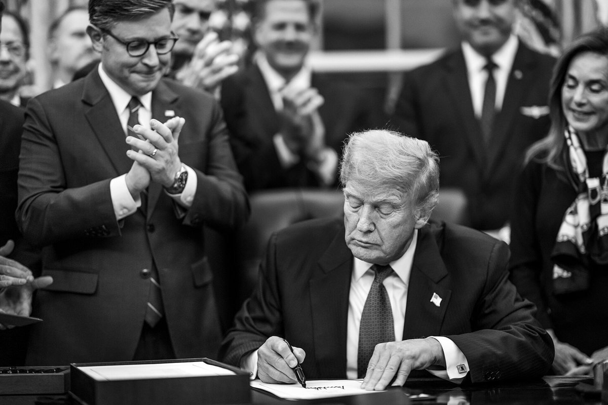 President Donald Trump signs the funding bill that ended the 43-day shutdown, with Speaker Mike Johnson, in the Oval Office on 12 November 2025