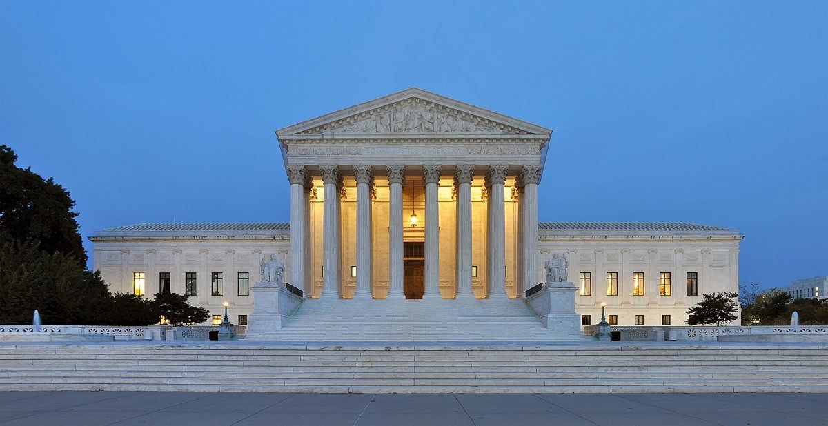 The US Supreme Court building in Washington, D.C., at dusk