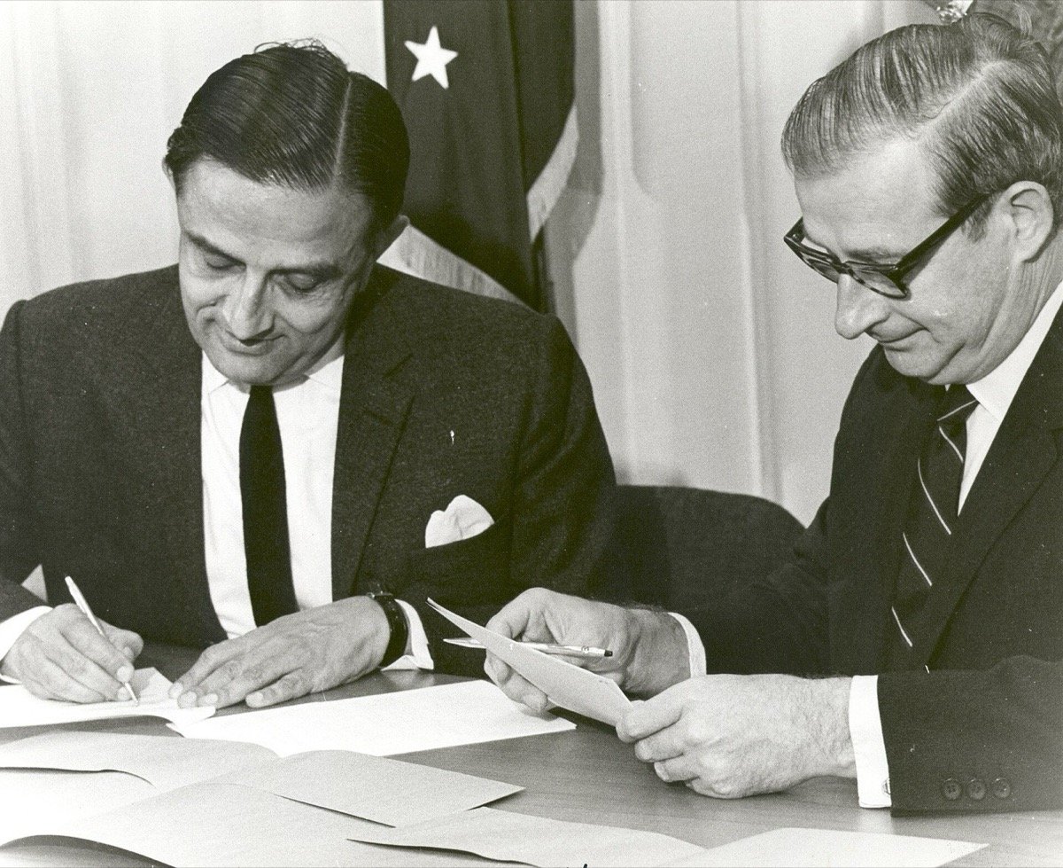 Vikram Sarabhai (left) and NASA Administrator Thomas Paine sign the satellite television agreement on 18 September 1969
