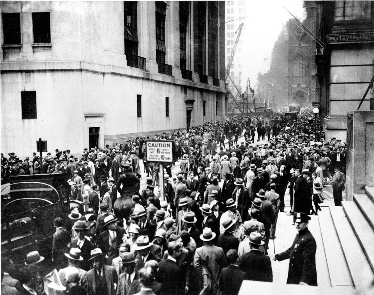 Crowds in the Wall Street district outside the New York Stock Exchange on Black Thursday, 24 October 1929