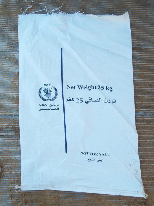An empty 25 kg World Food Programme flour sack marked not for sale